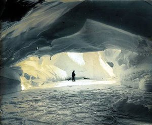 Ice cave, frozen sea and pancake ice foreground