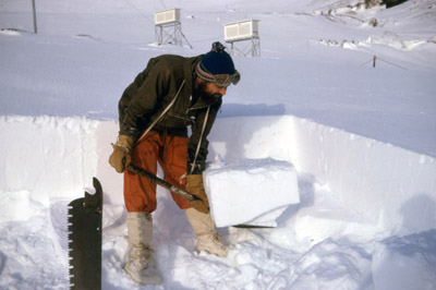 Bailey, A.D. cutting snow blocks for fresh water