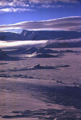 Clouds mountains sea ice winter
