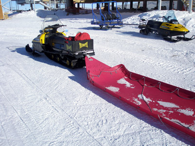 snow mobile and sled